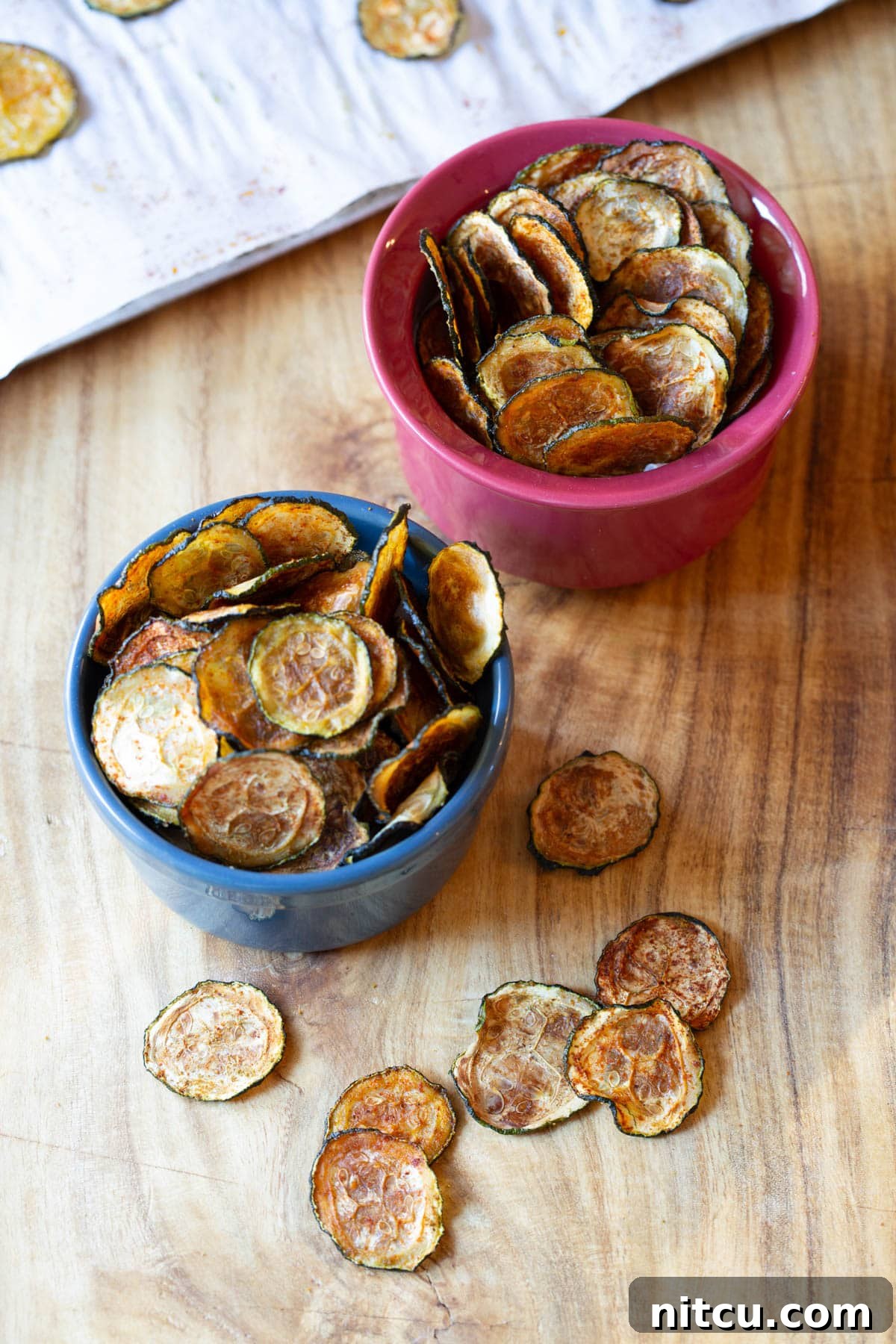 Chips made from zucchini served in small bowls. 