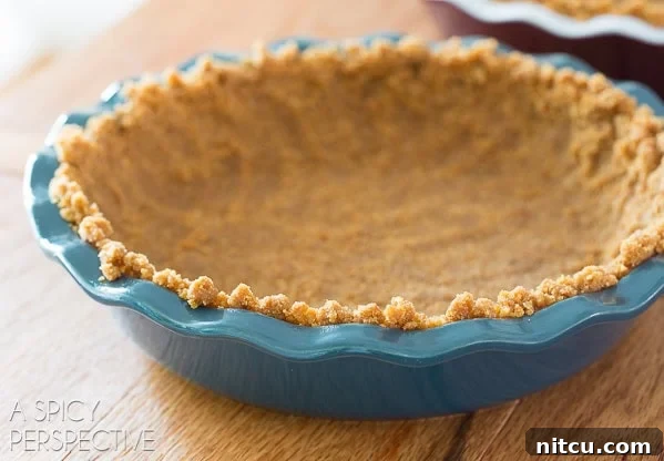 Lemon pie graham cracker crust ready to bake. 