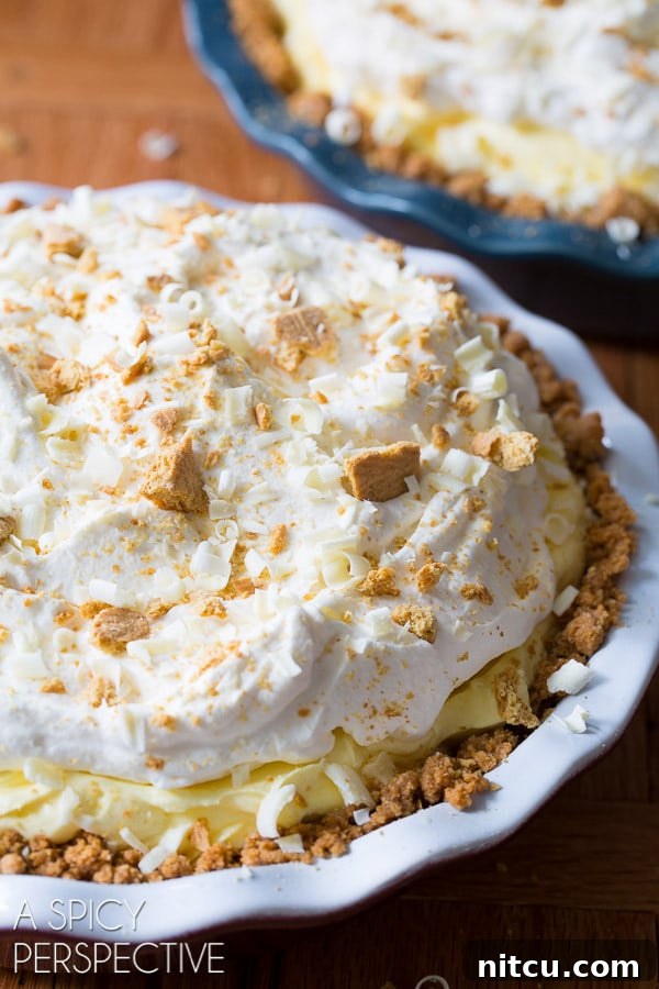 Ready lemon cream pie topped with garnishes. 