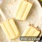 5-Ingredient Key Lime Pudding Pops - lime popsicles on a plate with graham cracker crust garnish