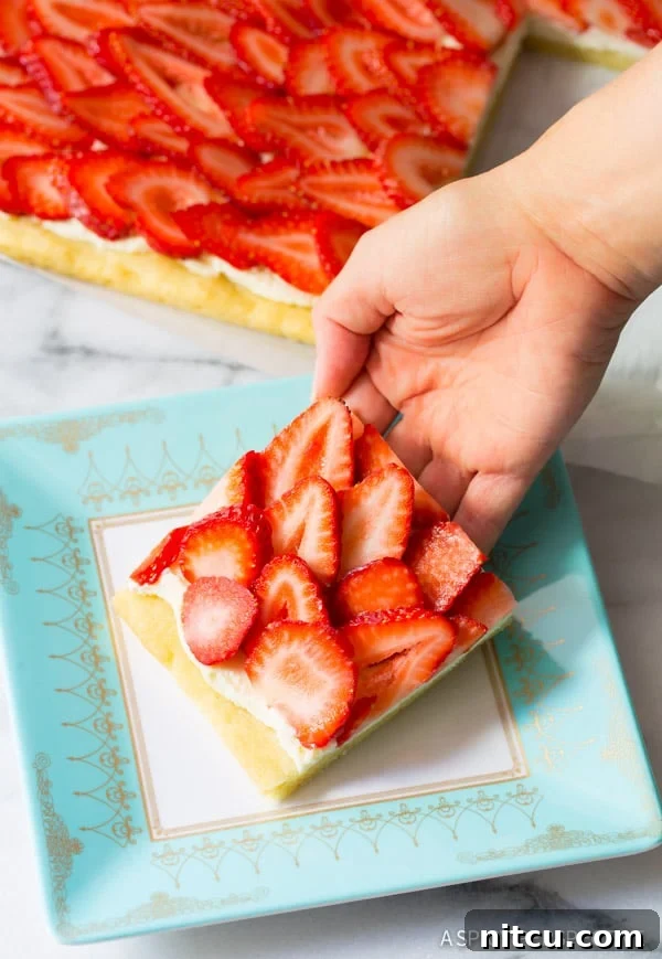 Close-up of freshly sliced strawberries on the dessert pizza.