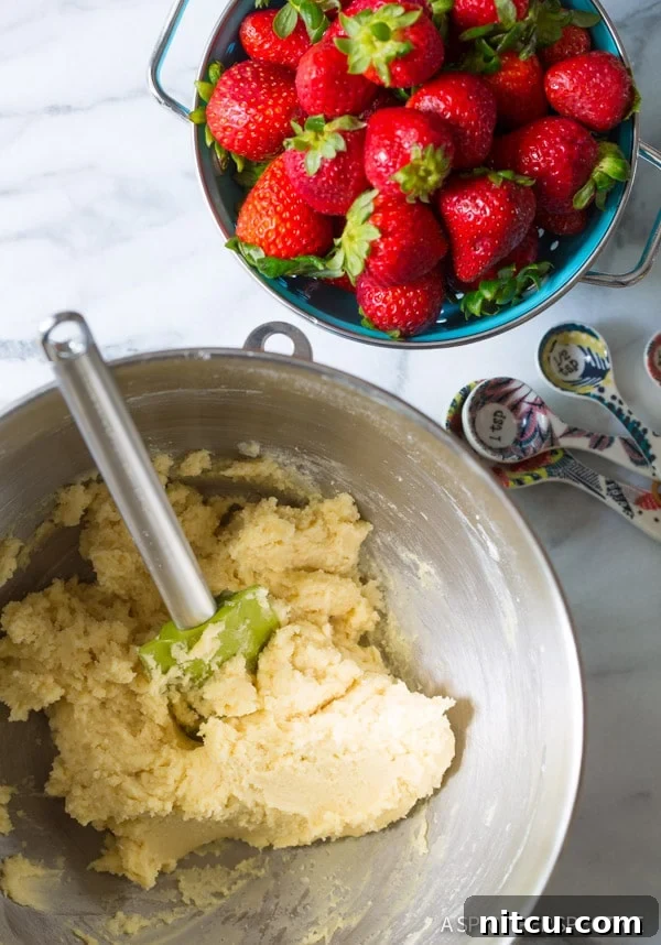 Homemade sugar cookie dough ready for baking, the base for the strawberry dessert pizza.
