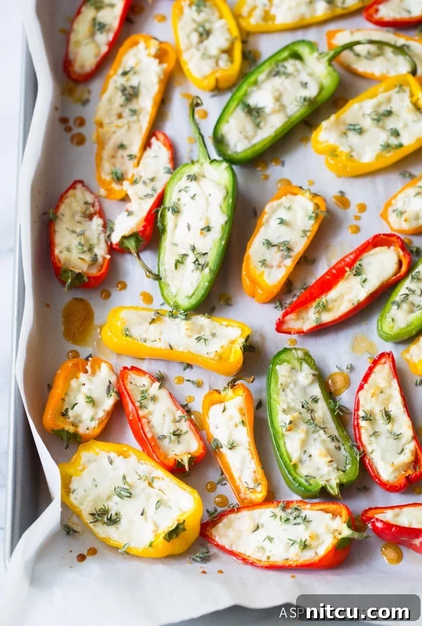 Love these 3-Ingredient Mini Stuffed Peppers Recipe on baking sheet