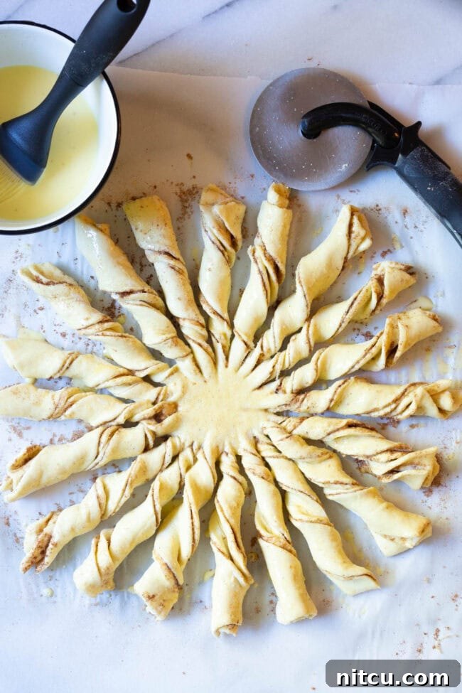 Twist the strips and lay in a sun pattern