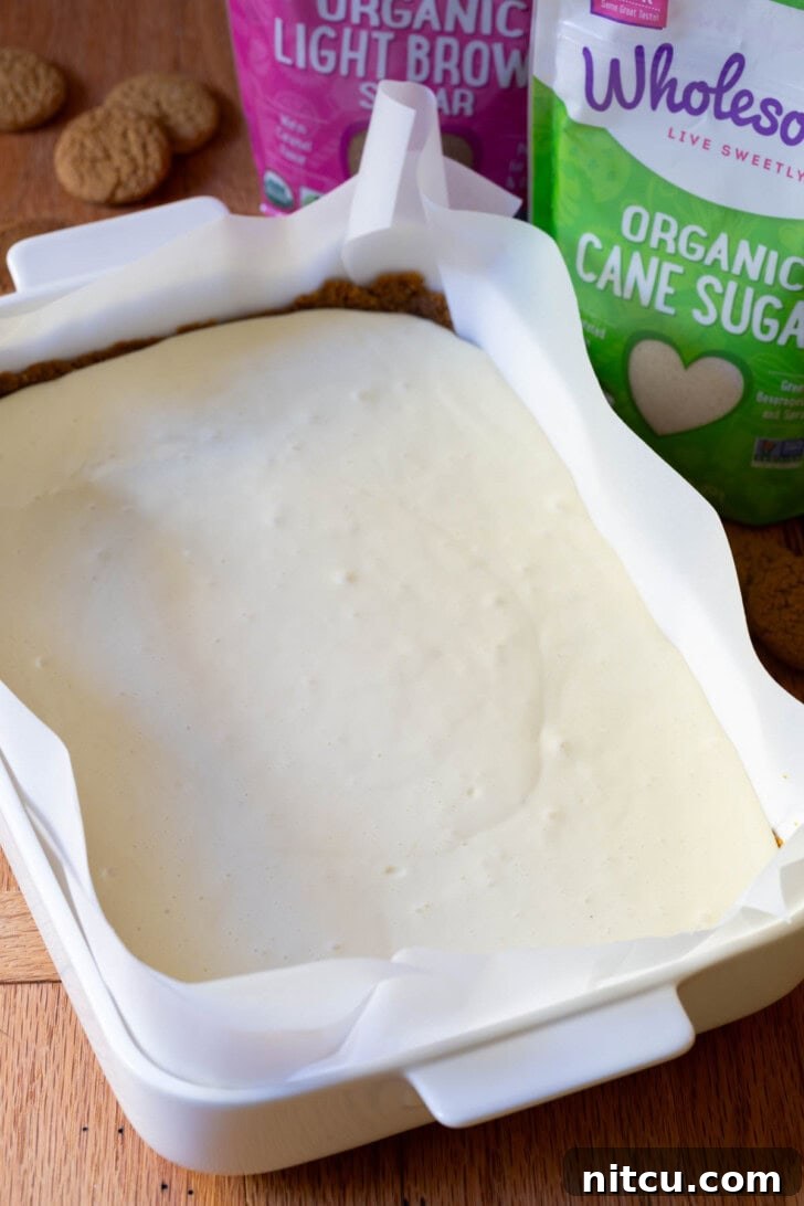 The baked and golden cheesecake layer, cooled and ready for the pumpkin topping.
