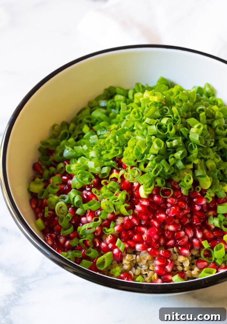 Ingredients for lentil salad in a bowl before being mixed. 