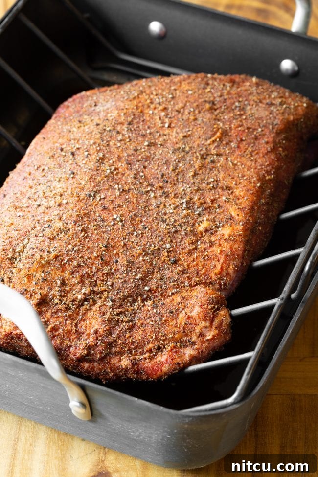 oven brisket recipe - beef brisket with dry rub in roasting pan