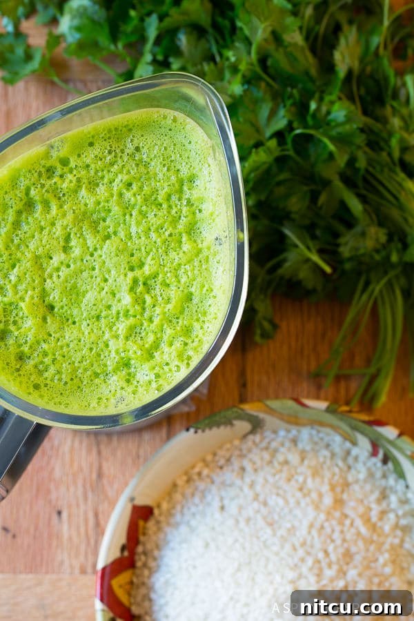 Risotto and Spinach - spinach and herb purée in blender to be poured over risotto.