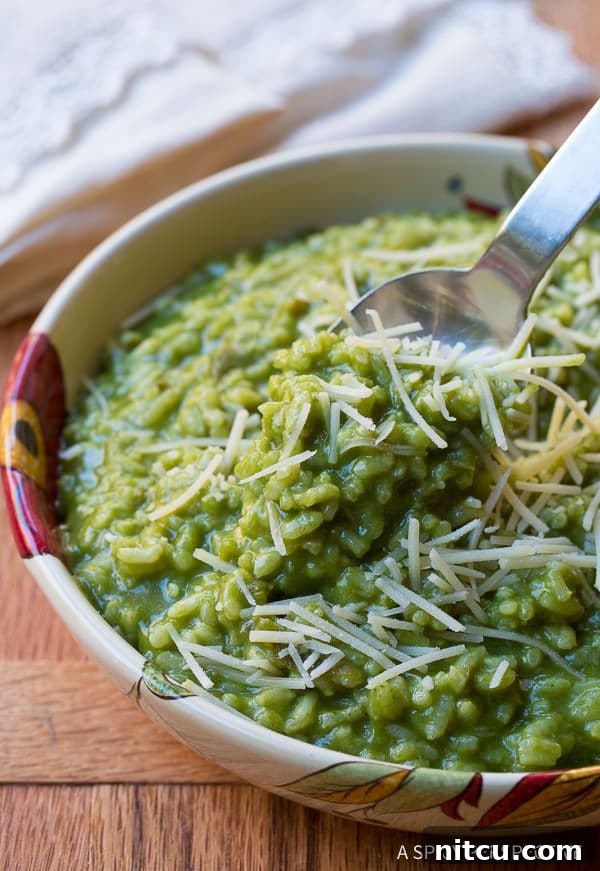 Taking a spoonful of green garlic parmesan risotto.