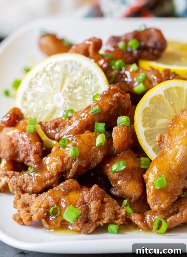 Crispy Paleo Lemon Chicken glazed with tangy sauce