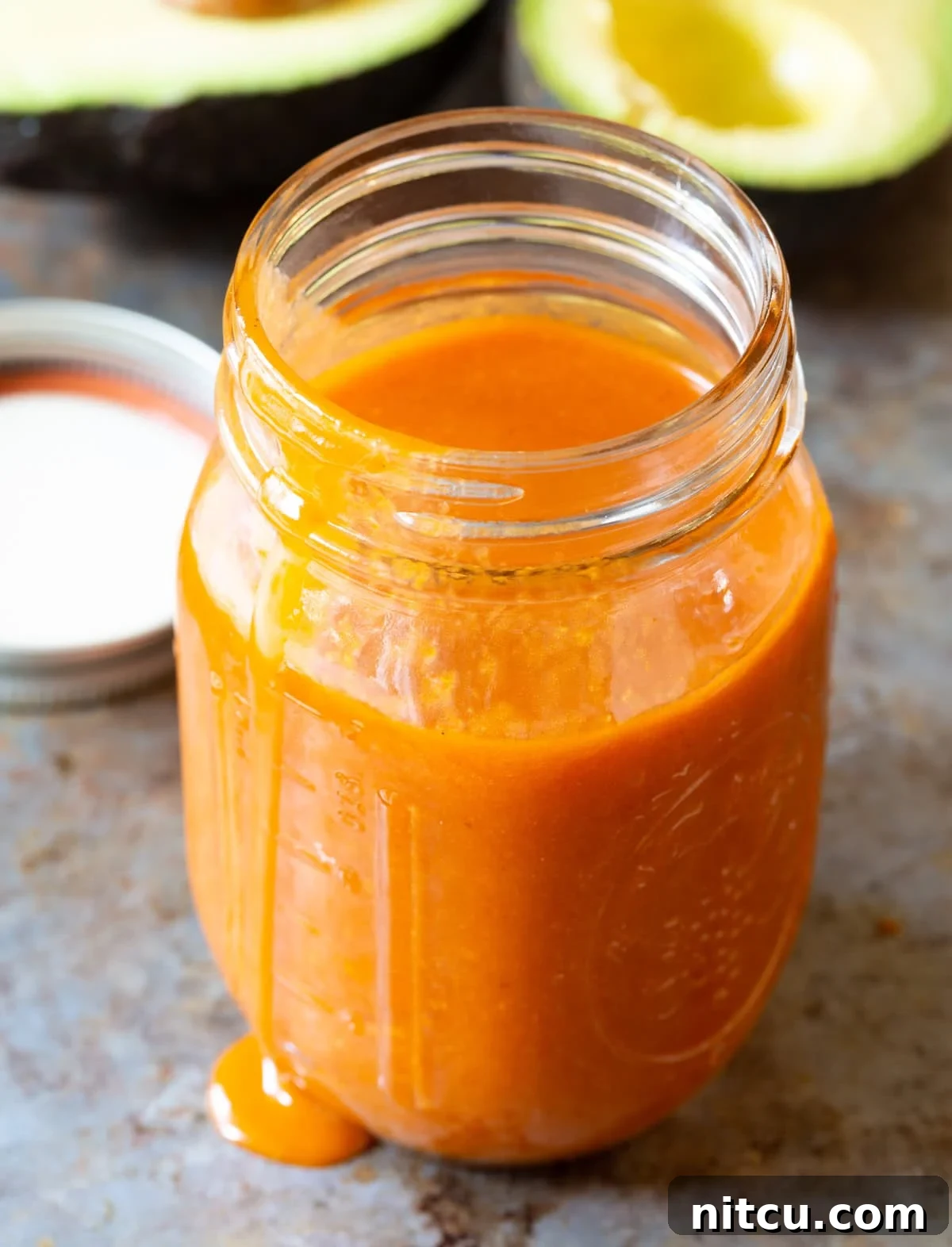 Homemade catalina dressing recipe with avocado in a mason jar.