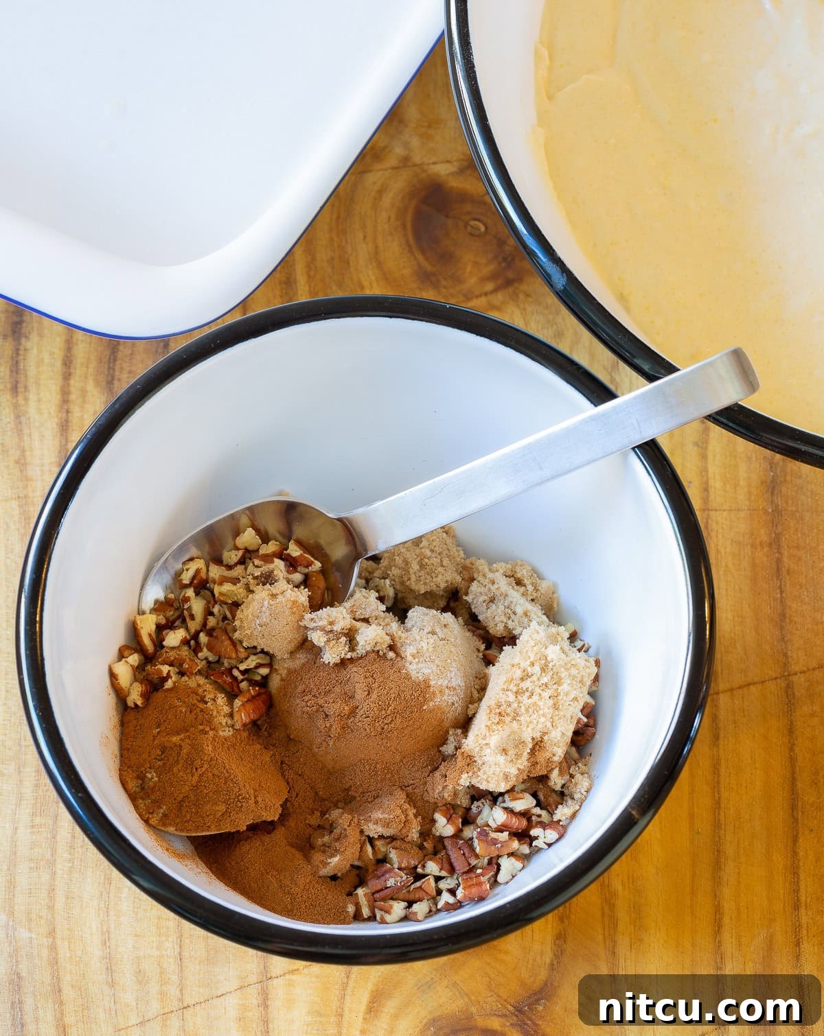 Sour Cream Coffee Cake ingredients in a small mixing bowl, showing the texture of the crumble mix