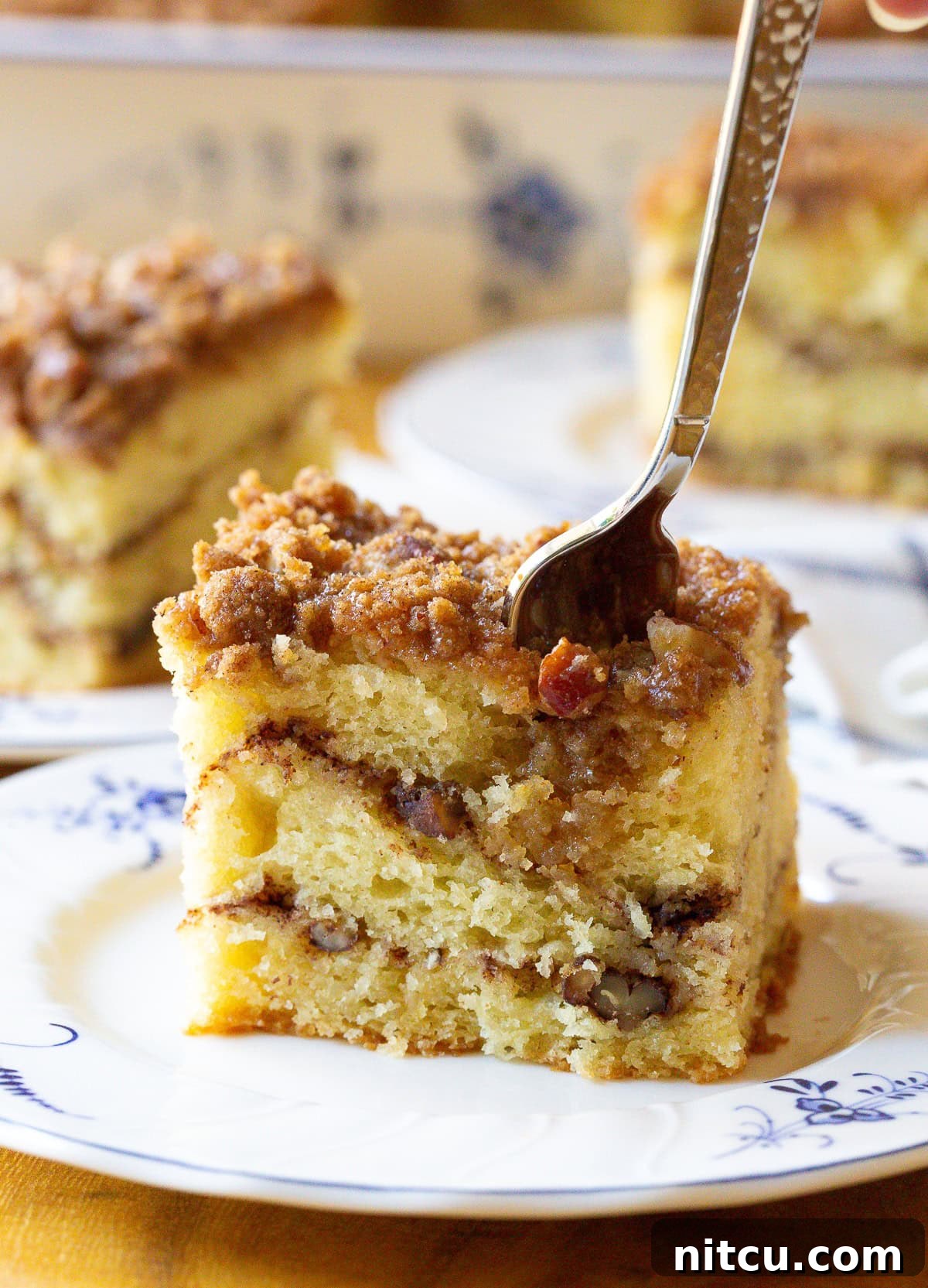 Easy Kahlua Coffee Cake side angle view of cake, highlighting its moist interior and crumble.