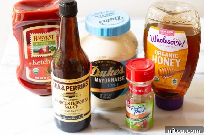A collection of ingredients artfully arranged on a marble surface, ready to be transformed into Southern Comeback Sauce.