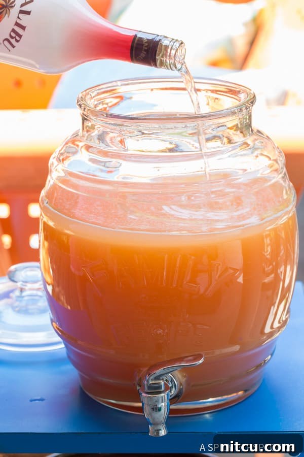 Alcoholic Party Punch with multiple types of rum bottles
