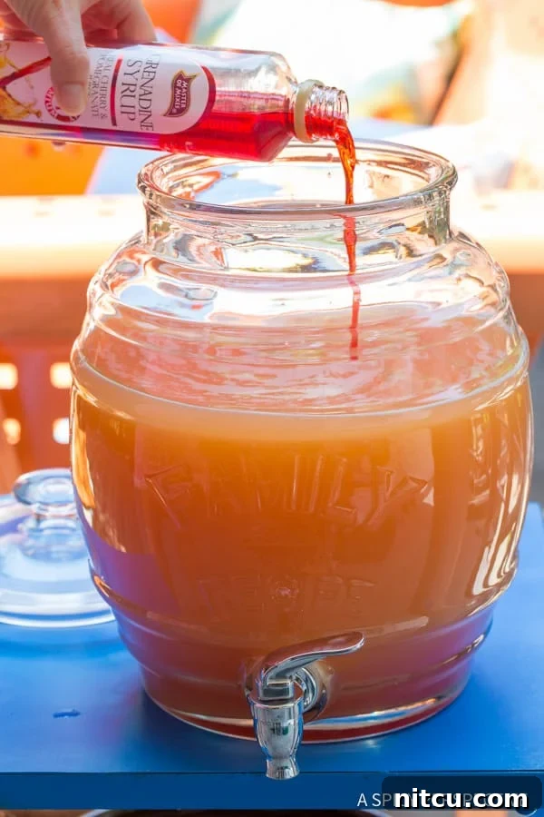 Adding Grenadine Syrup to Rum Punch, enhancing color and flavor