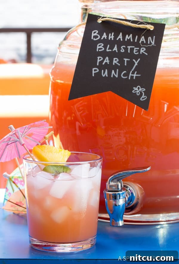 Rum Punch in glass with paper umbrella, ready for a party
