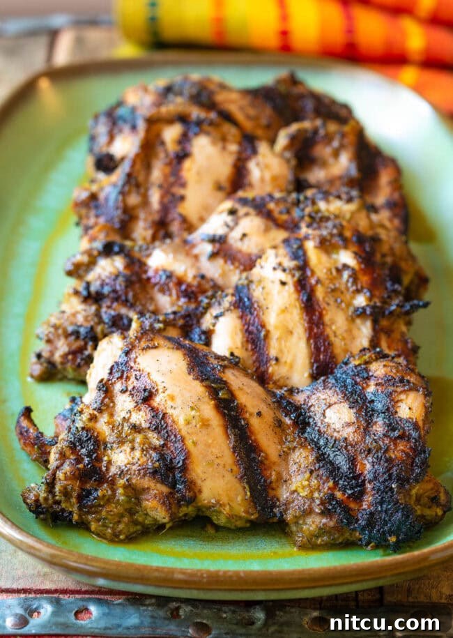 Close-up of perfectly grilled Jamaican Jerk Chicken Thighs