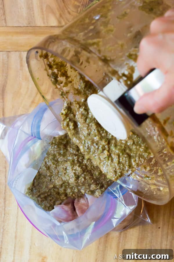 Boneless, skinless chicken thighs marinating in a gallon zip bag