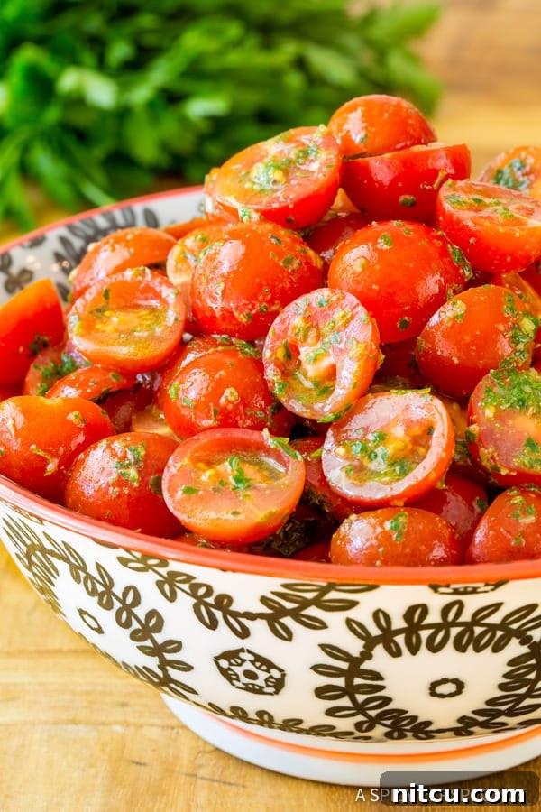 Close view of tomato chimichurri salad in a bowl.
