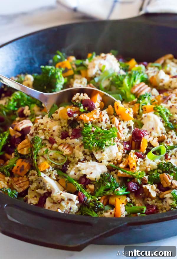 Love this Healthy One-Pot Chicken Broccoli Quinoa in large Cast Iron Skillet, showcasing a delicious, vibrant meal ready to be served for a wholesome family dinner.