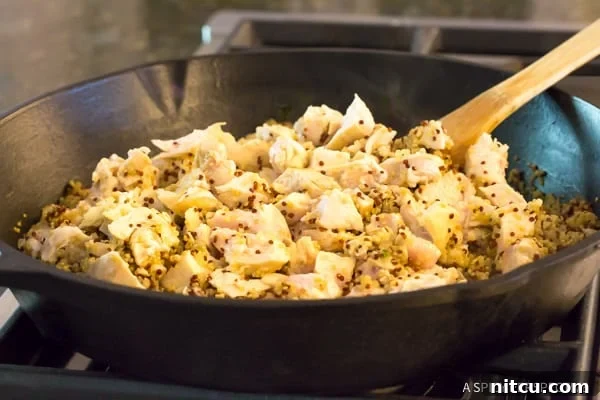 How To: Healthy One-Pot Chicken Broccoli with grains showing the cooked quinoa and chicken, ready for the final additions to create a complete meal.