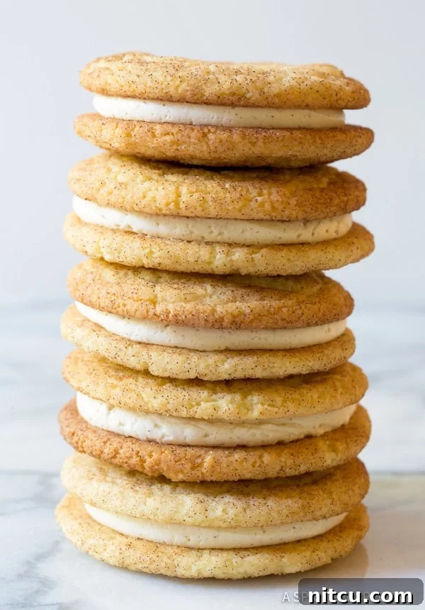 Snickerdoodle Sandwich Cookie Recipe with frosting in between stacked high
