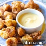 Final plated Chick-fil-A nuggets and sauce, ready to be enjoyed.