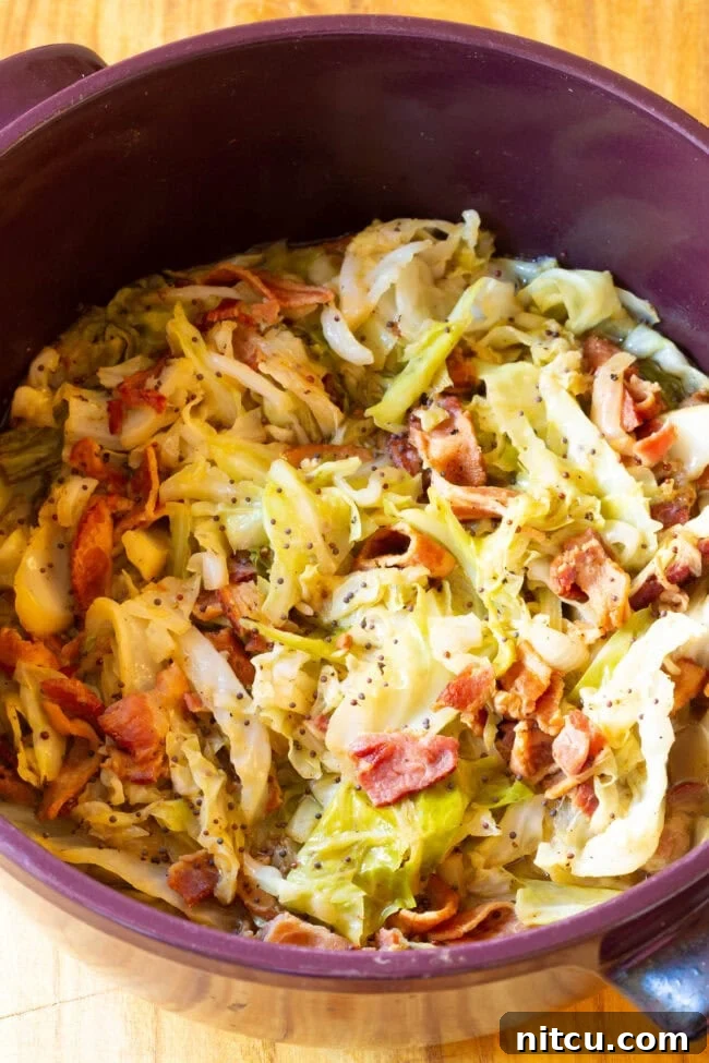 A large pot filled with cooked Irish bacon and cabbage, simmered to perfection and ready to be served.