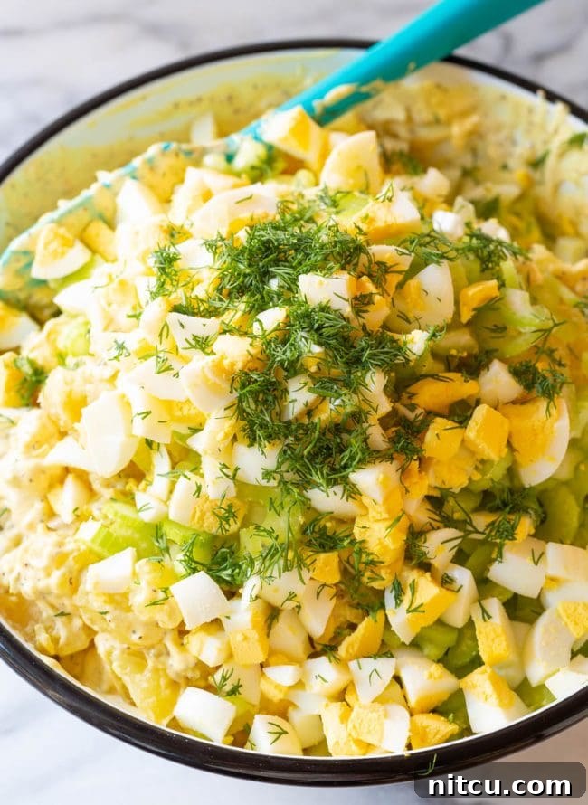 All the individual ingredients for potato salad laid out, before being mixed together.