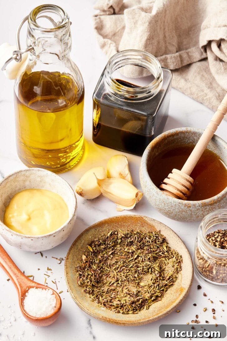 Ingredients needed for balsamic dressing recipe on counter.