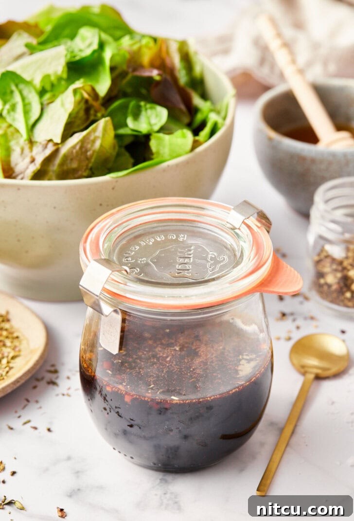 how to make balsamic dressing - close up of ingredients in jar