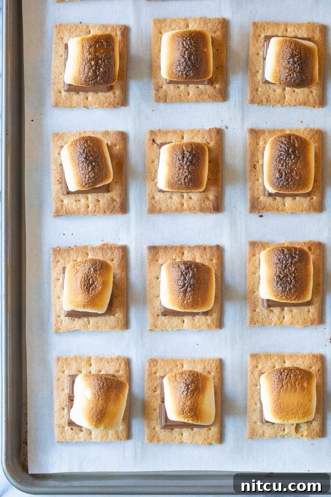 Marshmallows turning golden brown under the broiler.