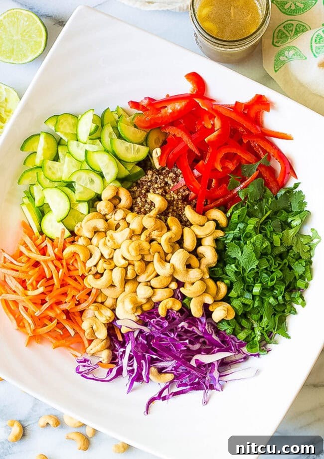 Healthy Thai Quinoa Salad toppings piled in a bowl, ready for tossing