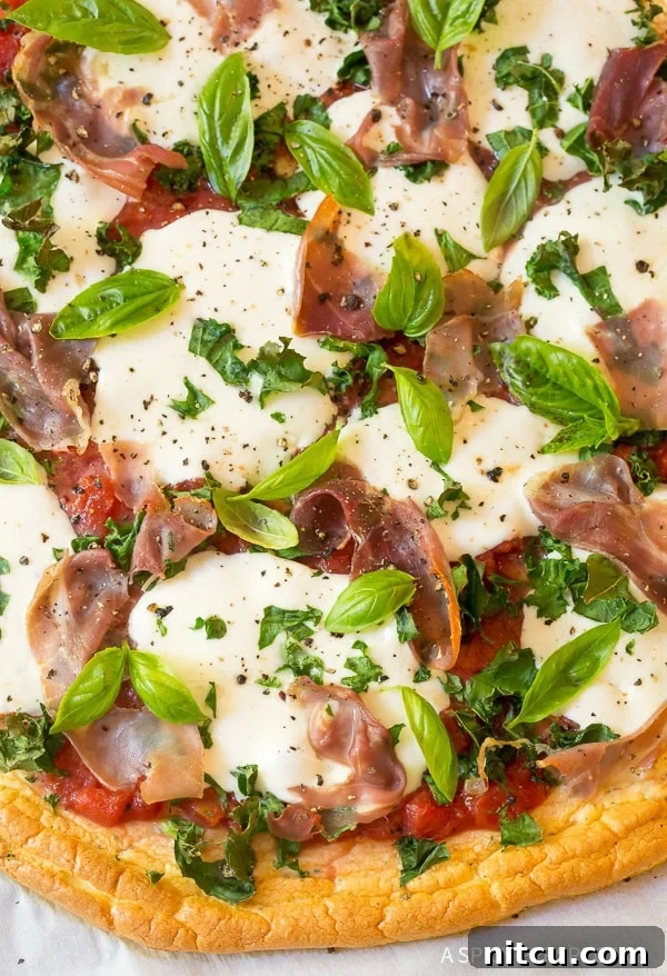 Close up shot of the toppings on top of cloud bread pizza.