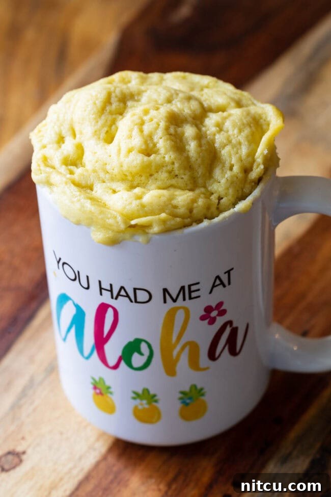 Mug with microwave bread popping out of the top.