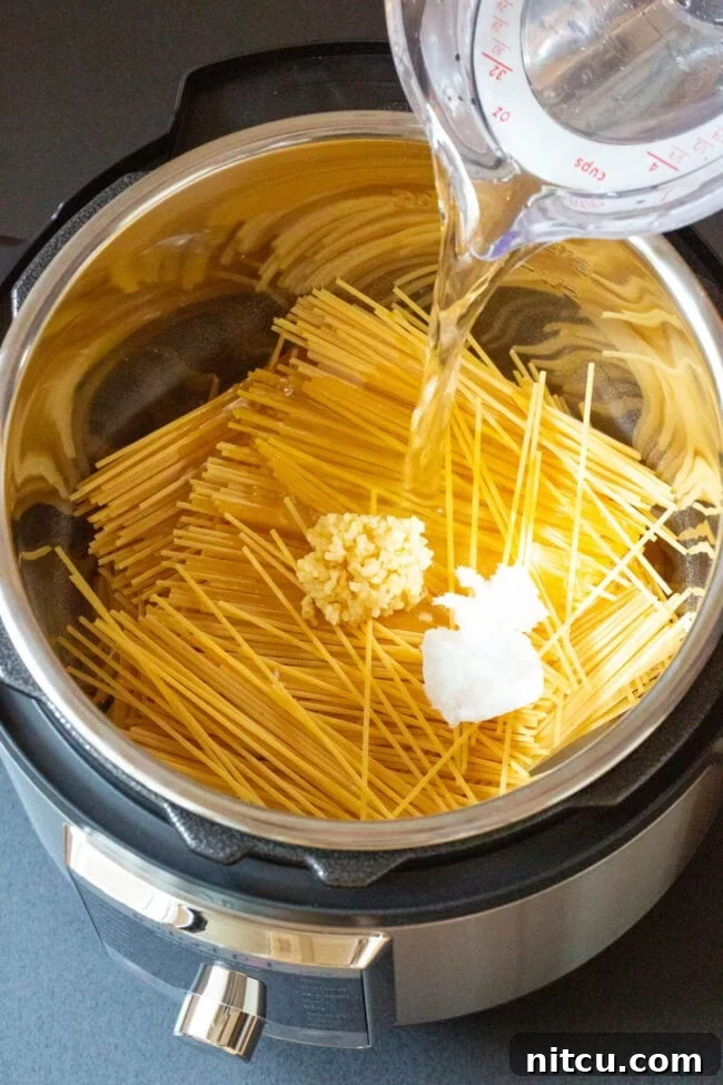 Making Instant Pot Bang Bang Shrimp Pasta Recipe