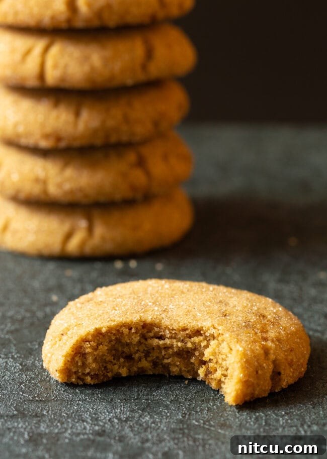 Brown sugar cookie recipe with a bite taken out, showing the soft interior.