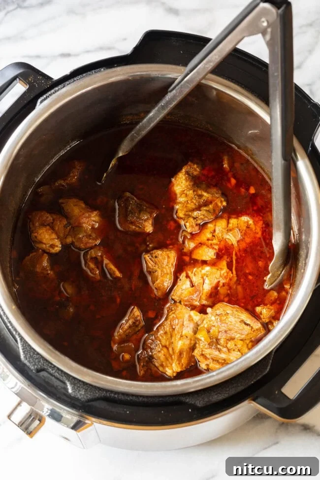 Perfectly cooked, tender pressure-cooked pork before shredding