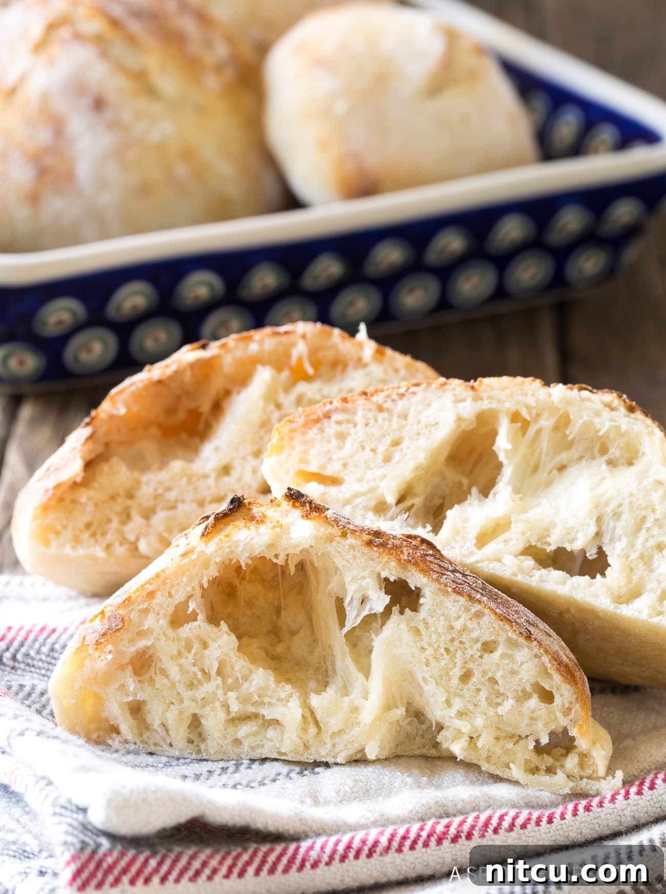 Bubbly Lepinja Bread Recipe - loaves cut open to expose air bubbles.