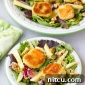 Fried Goat Cheese Salad with fresh greens, apples, and walnuts.