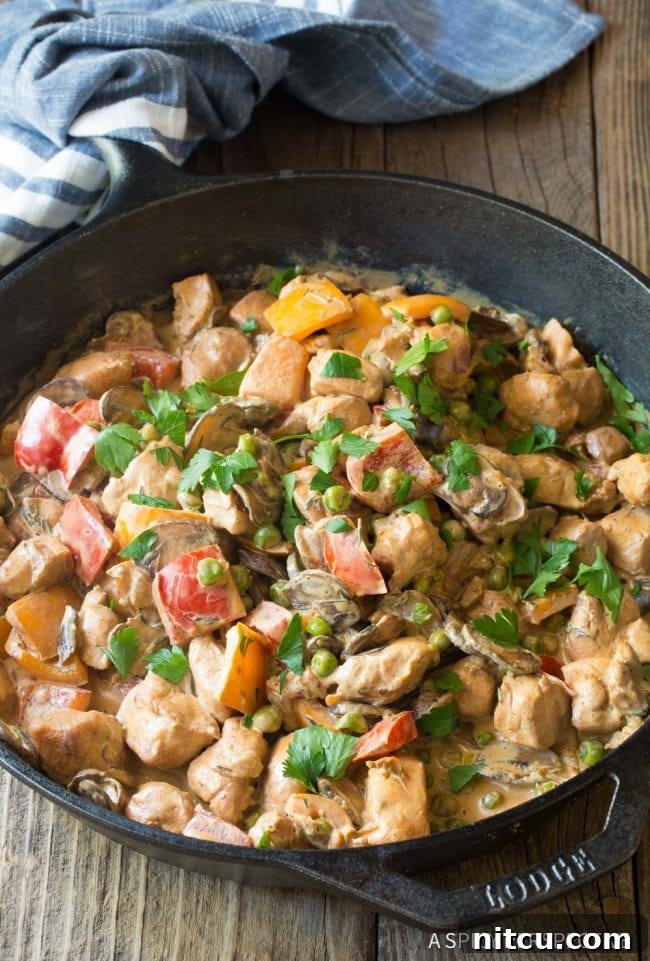 Finished Healthy Chicken A La King simmering in the skillet, ready to serve.