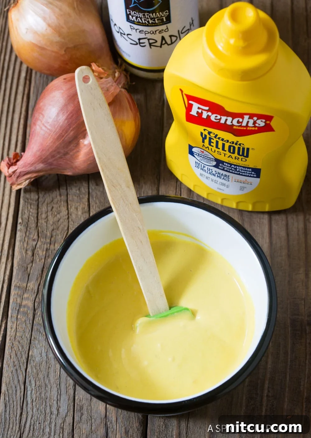 A collection of ingredients necessary for making the mustard seafood dipping sauce, neatly arranged.