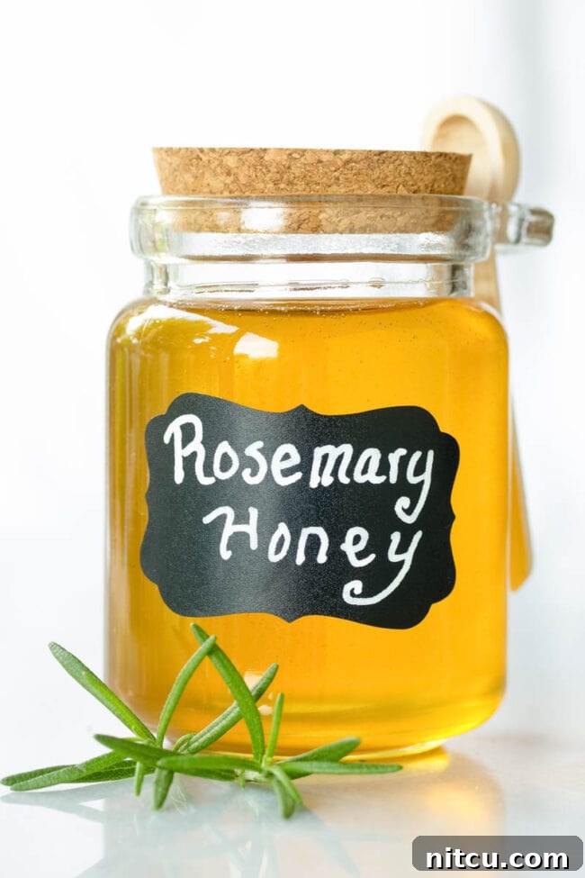 Infused Honey - Small glass container filled with honey and labeled 'rosemary honey'