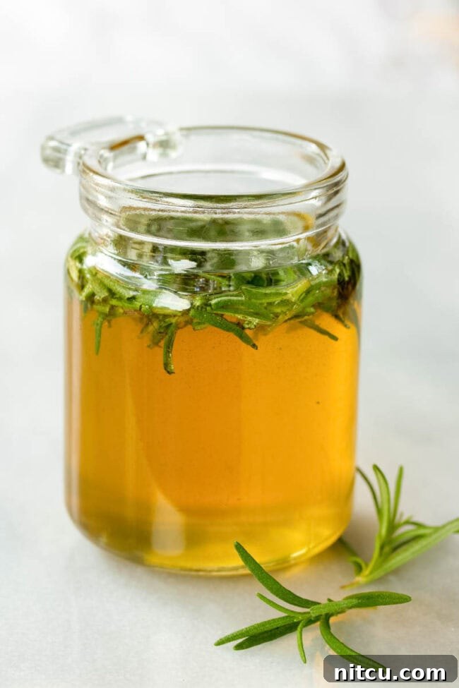 Cute little jar filled with honey and rosemary. 