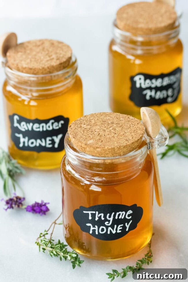 Different flavors of spiced honey in honey jars. 