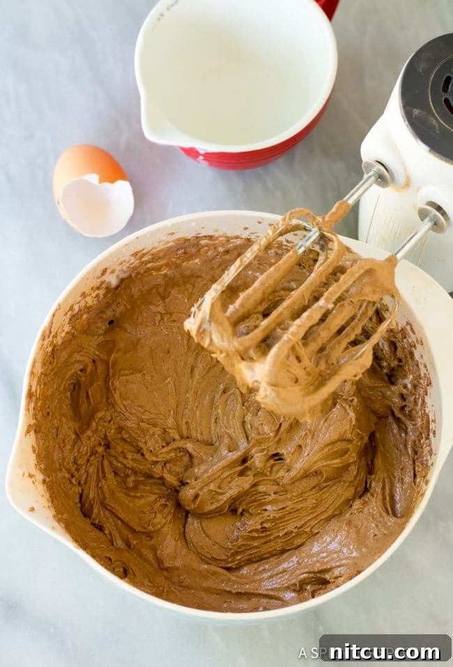 Preparing the Chocoflan Impossible Cake batter ingredients.