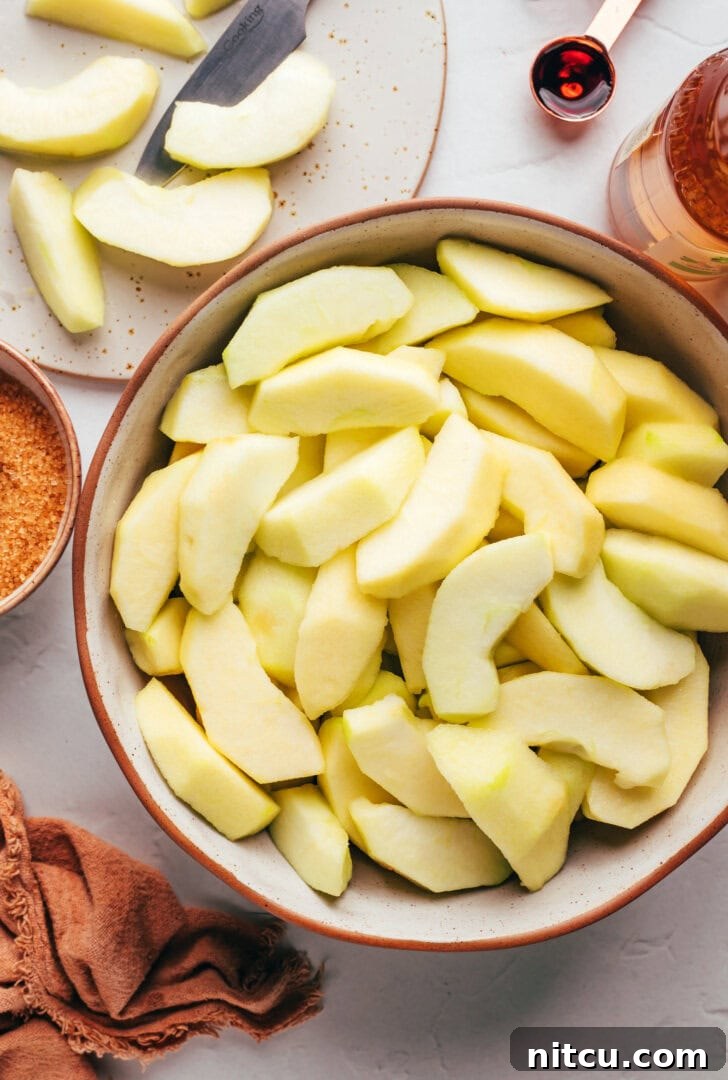 Sliced apples for pressure cooker spiced apples. 