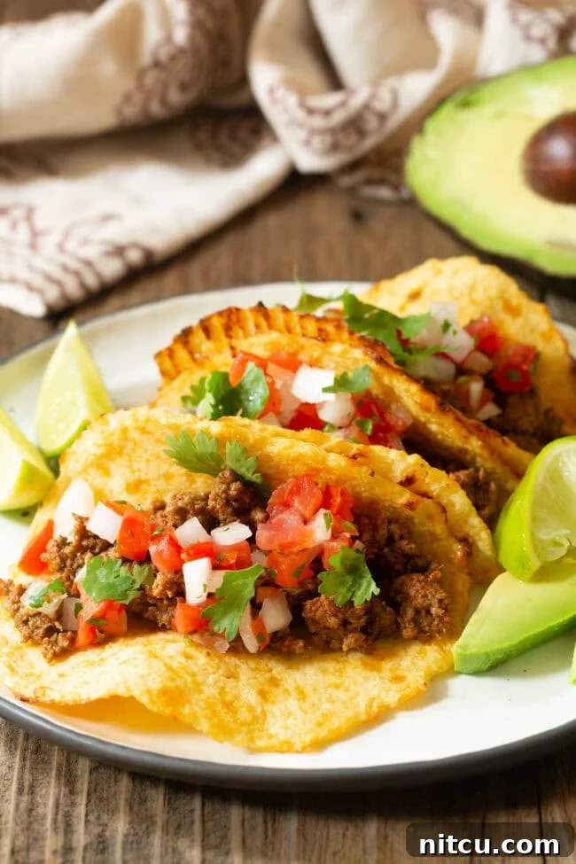 Low Carb Tortillas with various taco fillings arranged appealingly on a plate.
