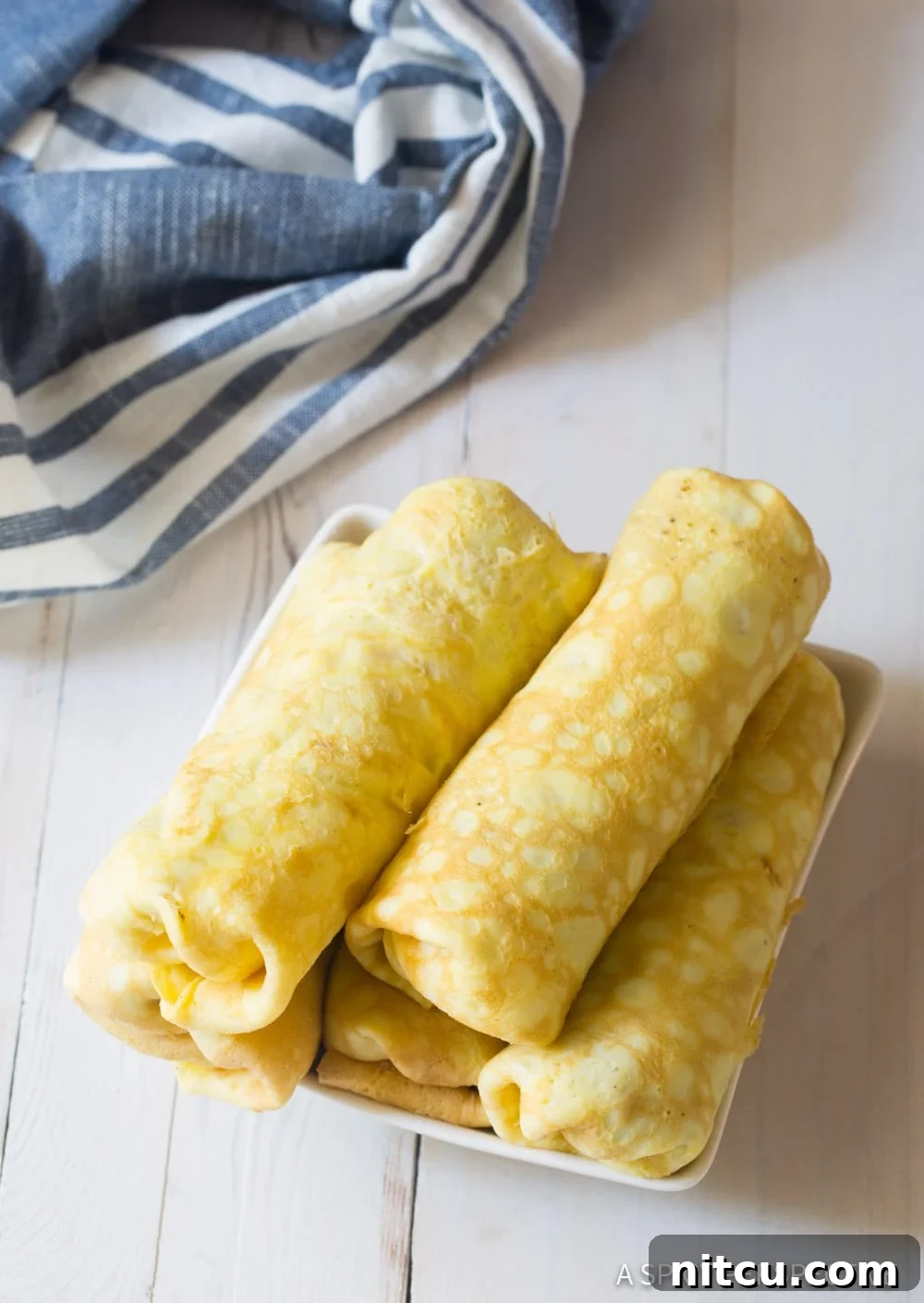 Stacked rolled up keto egg rolls. 